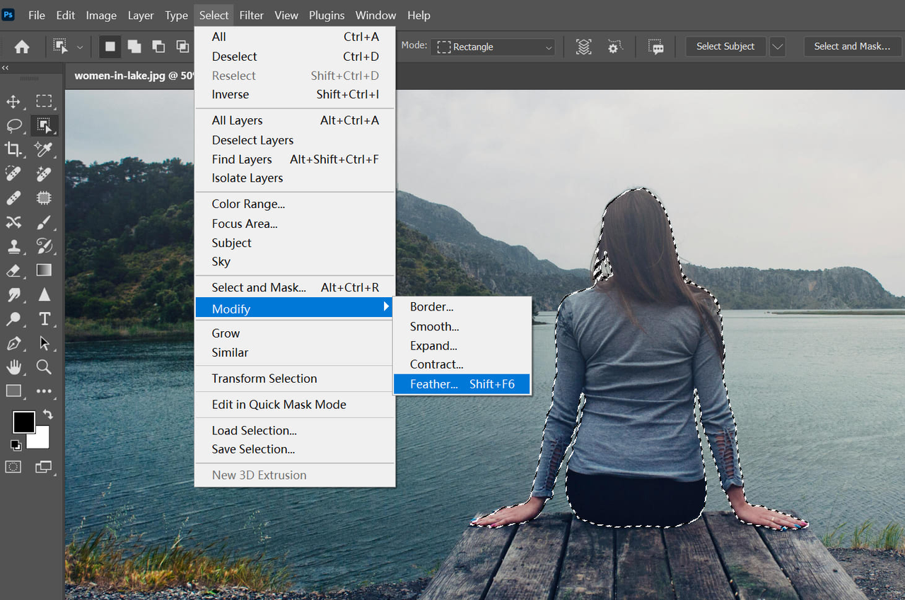 Interface showing how to blur the edges of a photo in Photoshop using feather selection