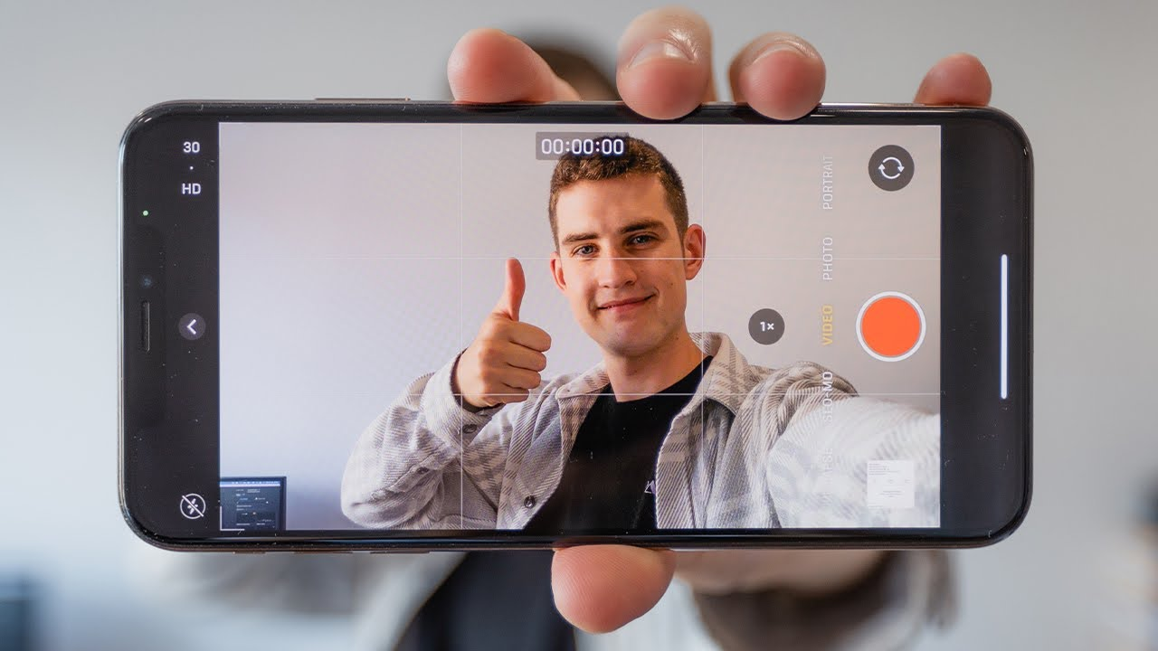 A man recording a vlog on a mobile phone