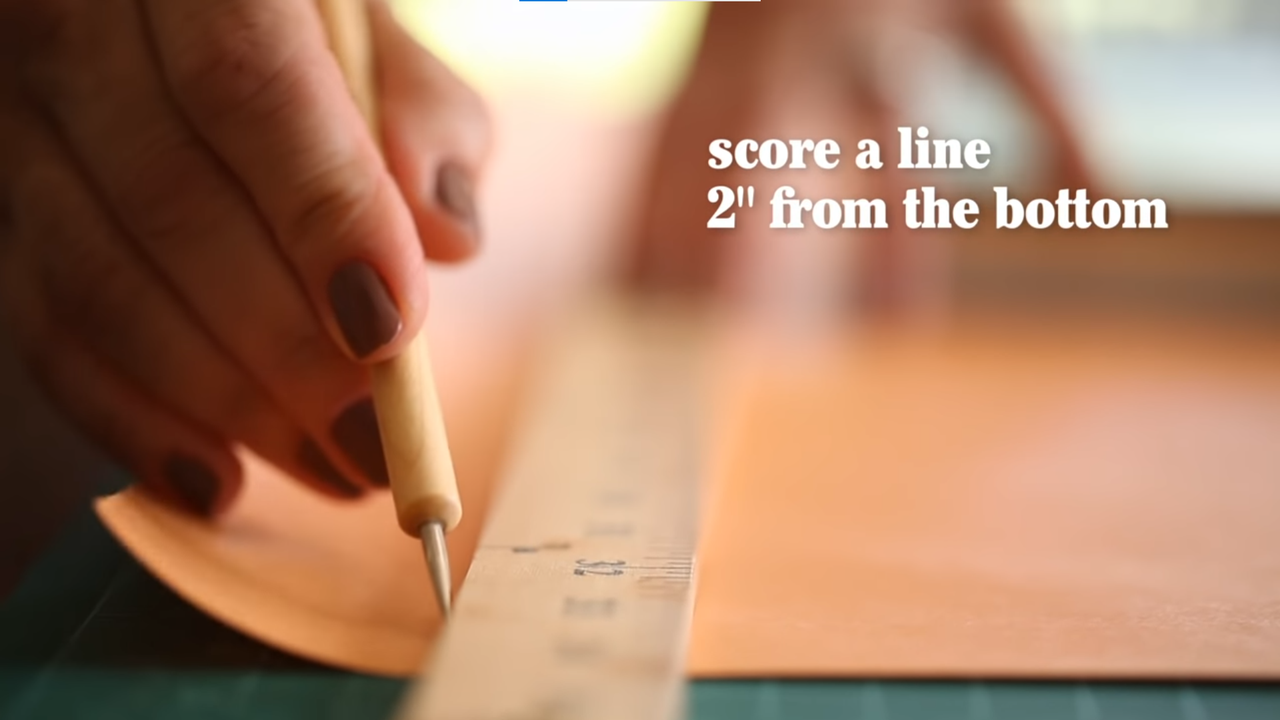 Score a line 2" from the bottom of the paper