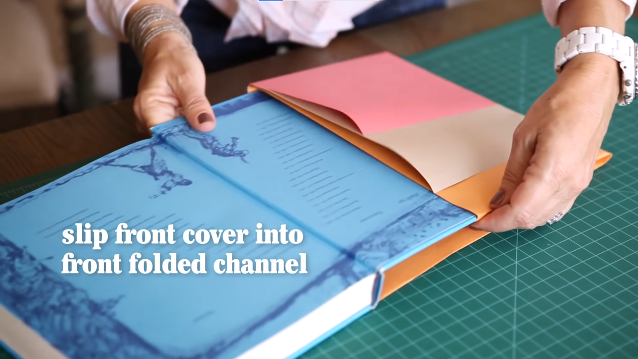 Slip the front cover into the folded channel